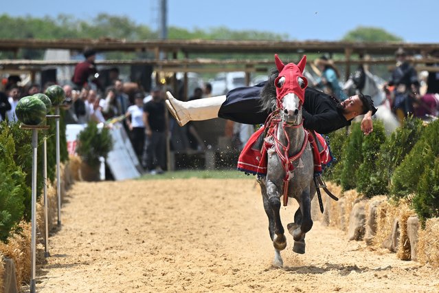 A participant takes part in a traditional sports and games show organized at the 7th Ethnosport Culture Festival held by the World Ethnosport Confederation at Ataturk Airport in Istanbul, Turkiye on May 22, 2025. The festival was attended by participants from 35 countries. (Photo by Ahmet Okatali/Anadolu via Getty Images)