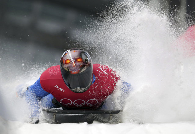 Joseph Luke Cecchini of Italy brakes in the finish area during the men's skeleton training at the 2018 Winter Olympics in Pyeongchang, South Korea, Wednesday, February 14, 2018. (Photo by Michael Sohn/AP Photo)