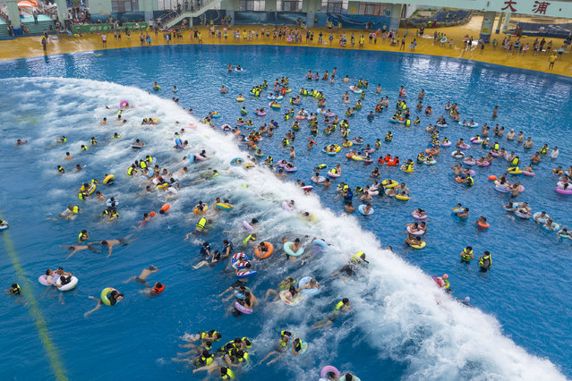 Aerial view of tourists enjoying the coolness at Dapu Tsunami World water park in summer on July 12, 2025 in Wuhu, Anhui Province of China. (Photo by Xiao Benxiang/VCG via Getty Images)