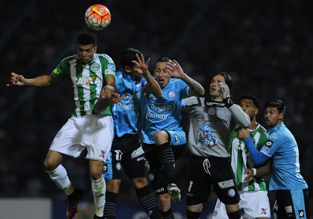 Coritiba's Juninho (L) heads the ball while in action against Belgrano players during their match of the Sudamerican Cup at Mario Alberto Kempes Stadium in Cordoba, Argentina, 28 September 2016. (Photo by Pedro Castillo/EPA)