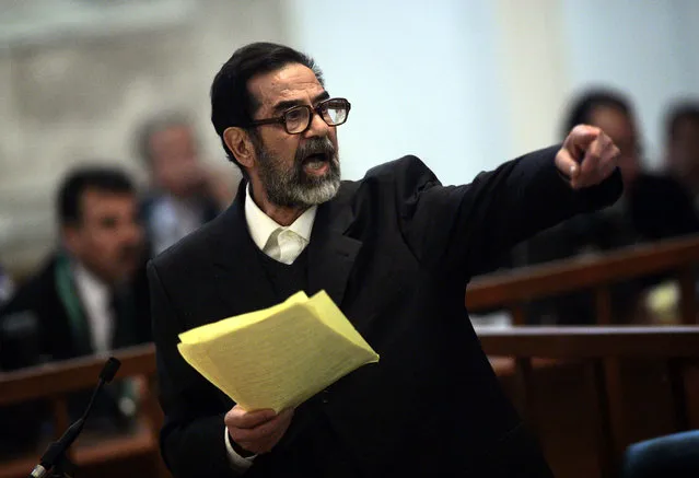 Former Iraqi President Saddam Hussein argues with prosecutors while testifying during cross-examination at his trial in Baghdad's Green Zone, April 5, 2006. (Photo by David Furst/Reuters)