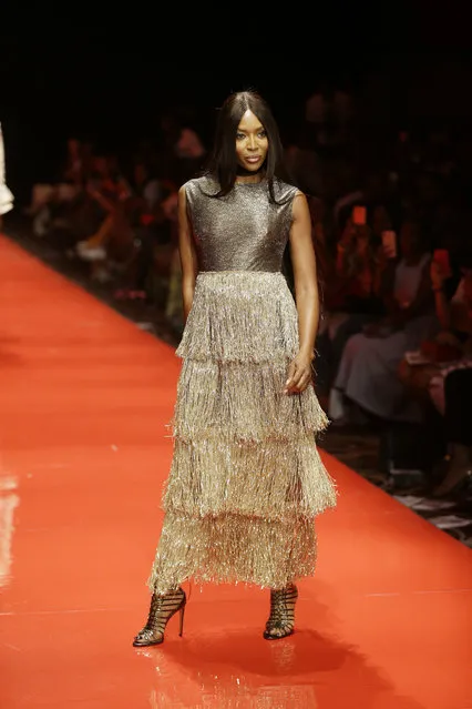 British supermodel Naomi Campbell displays an outfit by Nigeria designer Lanre Da Silva Ajayi during the ARISE Fashion Week event in Lagos, Nigeria, Saturday, March 31, 2018. (Photo by Sunday Alamba/AP Photo)