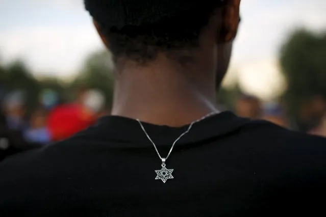 A member of the Ethiopian Jewish community in Israel wears a medallion with the Star of David as he takes part in a ceremony marking the holiday of Sigd in Jerusalem November 11, 2015. (Photo by Amir Cohen/Reuters)