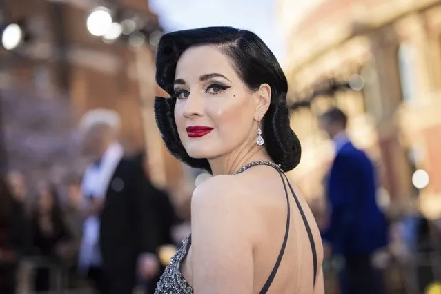 American vedette, burlesque dancer and model Dita Von Teese poses for photographers upon arrival at the Olivier Awards in London, Sunday, April 2, 2023. (Photo by Vianney Le Caer/Invision/AP Photo)