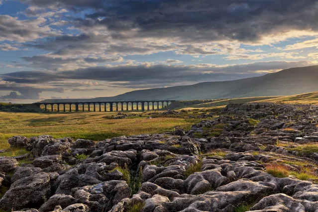 Sunshine Breaks Through, taken at Ribblehead Viaduct in North Yorkshire, won the Network Rail “Lines in the Landscape” award. (Photo by Francis Joseph Taylor/PA Wire)