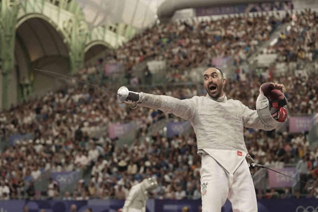Iran's Ali Pakdaman reacts in the men's team Sabre quarterfinal match against United States' Colin Heathcock during the 2024 Summer Olympics at the Grand Palais, Wednesday, July 31, 2024, in Paris, France. (Photo by Thibault Camus/AP Photo)