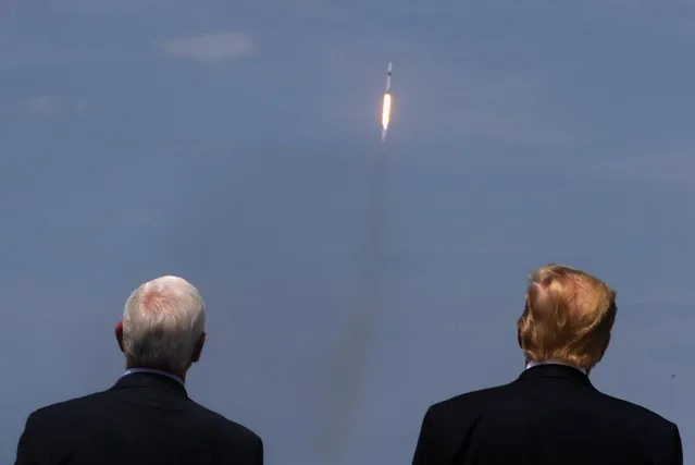 U.S. President Donald Trump and Vice President Mike Pence watch the launch of a SpaceX Falcon 9 rocket and Crew Dragon spacecraft, from Cape Canaveral, Florida, U.S. May 30, 2020. (Photo by Jonathan Ernst/Reuters)