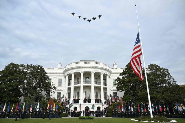 US President Donald Trump and Crown Prince and Prime Minister of the Kingdom of Saudi Arabia Mohammed bin Salman watch a flyover of military aircraft on the South Lawn at the White House in Washington, DC on November 18, 2025. Saudi Crown Prince Mohammed bin Salman arrived at the White House to fanfare and a jet flyover Tuesday, in his first visit to the United States since the 2018 murder of journalist Jamal Khashoggi. (Photo by Brendan Smialowski/AFP Photo)