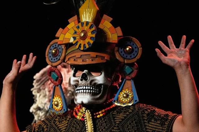 An acrobat from a Mexican theater company performs the show titled "Mortal Leap into Xibalba," which reinterprets a myth from a sacred Mayan book about creation and the journey to the underworld, in Mexico City, Saturday, November 22, 2025. (Photo by Marco Ugarte/AP Photo)