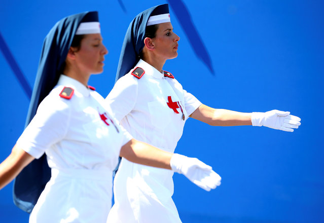 Italian Red Cross nurses march during the Republic Day military parade in Rome, Italy, June 2, 2018. (Photo by Tony Gentile/Reuters)