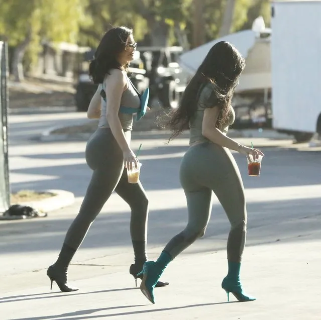 Kim Kardashian and Kylie Jenner are striking in  tight outfits in Calabasas on June 11, 2018. (Photo by Akra/X17online.com)