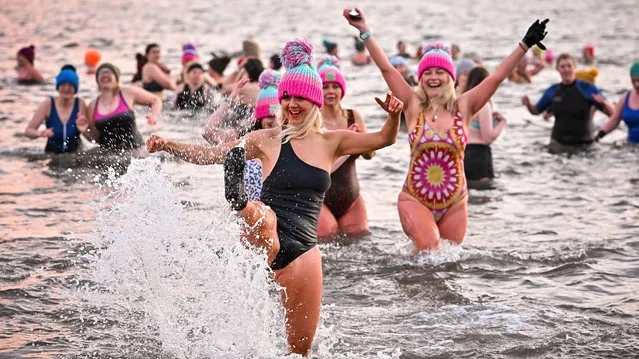Several hundred swimmers took a sunrise dip in the North Sea at Portobello Beach, for the International Women’s Day Swimrise on March 08, 2022 in Edinburgh, Scotland. Women from all backgrounds, abilities and ages come together in aid of Edinburgh Women’s Aid, Edinburgh Rape Crisis and Held in Our Hearts. (Photo by Jeff J. Mitchell/Getty Images)