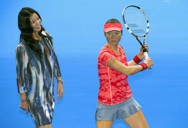 Current Australian Open tennis women's champion China's Li Na stands next to her Madame Tussauds wax figure on Rod Laver Arena at Melbourne Park January 18, 2015. The Australian Open tennis tournament begins on January 19. (Photo by Fiona Hamilton/Reuters/Tennis Australia)
