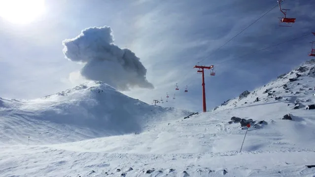 A volcano erupts near a ski lift at Nevados de Chillan, Chile on August 8, 2018 in this image obtained from social media. (Photo by Birgit Ertl via Reuters)