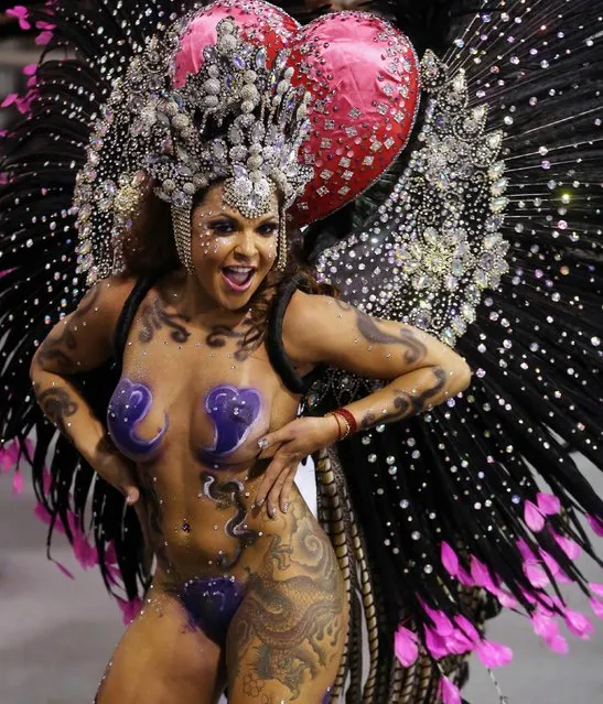 A reveller from the Vai-Vai Samba School takes part in a carnival at Anhembi Sambadrome in Sao Paulo, February 15, 2015. (Photo by Paulo Whitaker/Reuters)