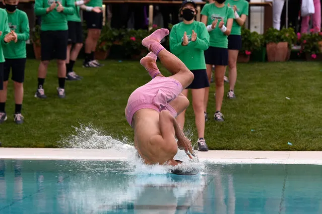 Spain's Rafael Nadal jumps in a pool after winning the ATP Barcelona Open tennis tournament singles final match against Greece's Stefanos Tsitsipas at the Real Club de Tenis in Barcelona on April 25, 2021. (Photo by Josep Lago/AFP Photo)