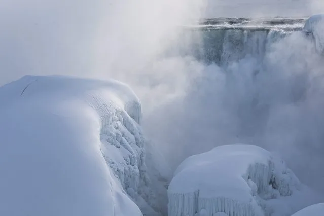 Masses of ice form in the lower Niagara River and around the American Falls as seen from Niagara Falls, Ontario, Canada, Thursday, February 19, 2015. (Photo by Aaron Lynett/AP Photo/The Canadian Press)