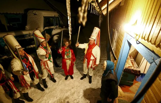 Belarussian villagers perform during a celebration of the "Tsary" rite in the village of Semezhevo, Belarus January 13, 2016. (Photo by Vasily Fedosenko/Reuters)