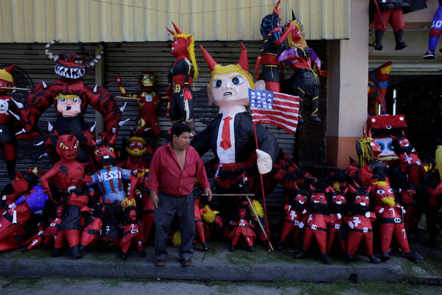 A pinata representing U.S. President-elect Donald Trump as a devil is seen outside a pinata store before it is set on fire at the traditional Burning of the Devil festival, ahead of Christmas in Guatemala City, Guatemala, December 7, 2016. (Photo by Luis Echeverria/Reuters)