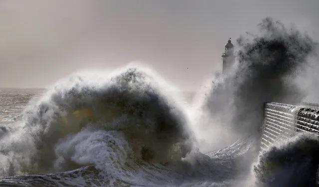 Waves crash over Tynemouth pier on the North East coast of England on Monday, April 24, 2023. (Photo by Owen Humphreys/PA Images via Getty Images)