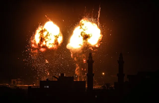 Flames are seen after an Israeli air strike hit Hamas targets in Gaza City, Gaza on June 15, 2021. (Photo by Ali Jadallah/Anadolu Agency via Getty Images)