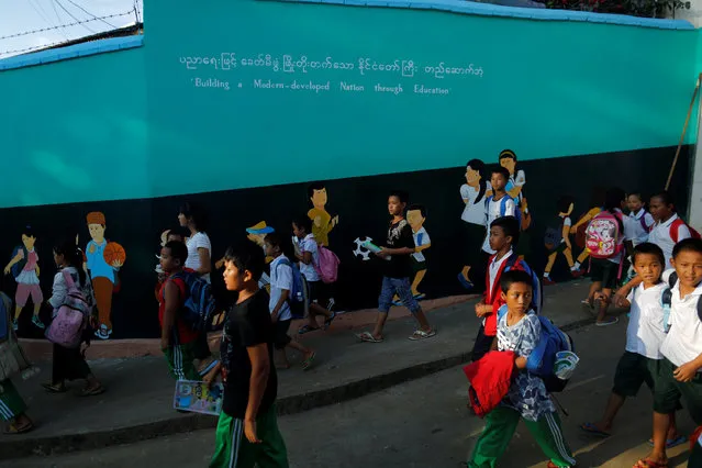 Children leave school in Namtit, Wa territory in northeast Myanmar November 30, 2016. (Photo by Soe Zeya Tun/Reuters)