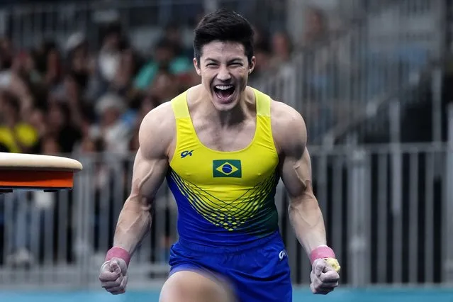 Brazil's Arthur Mariano celebrates after competing in the men's gymnastics vault exercise final at the Pan American Games in Santiago, Chile, Wednesday, October 25, 2023. Chile is hosting the Olympic-style event for the first time. (Photo by Martin Mejia/AP Photo)