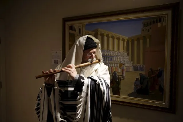 U.S.-Israeli musicologist David Louis plays a flute as part of a demonstration of biblical instruments at the Temple Institute in Jerusalem January 25, 2016. (Photo by Ronen Zvulun/Reuters)