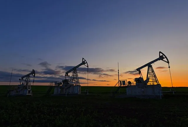 A view shows oil pump jacks outside Almetyevsk in the Republic of Tatarstan, Russia on June 4, 2023. (Photo by Alexander Manzyuk/Reuters)