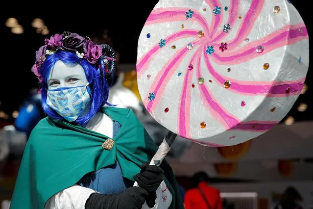 A woman in costume poses for a photograph at the 2021 New York Comic Con,at the Jacob Javits Convention Center in Manhattan in New York City, New York, U.S., October 7, 2021. (Photo by Brendan McDermid/Reuters)