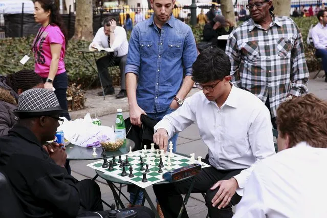 Men play chess in a park during a warm weather spell in New York March 10, 2016. (Photo by Lucas Jackson/Reuters)