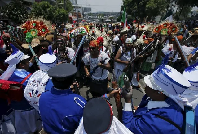 Mexicans wearing period costumes re-enact the battle of Puebla, in Mexico City May 5, 2015. (Photo by Henry Romero/Reuters)