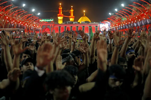 Shiite pilgrims gather between the holy shrines of Imam Hussein and Imam Abbas for the Arbaeen Shiite festival in Karbala, Iraq, Monday, September 27, 2021. The holiday marks the end of the forty-day mourning period after the anniversary of the martyrdom of Imam Hussein, the Prophet Muhammad's grandson in the 7th century. (Photo by Anmar Khalil/AP Photo)