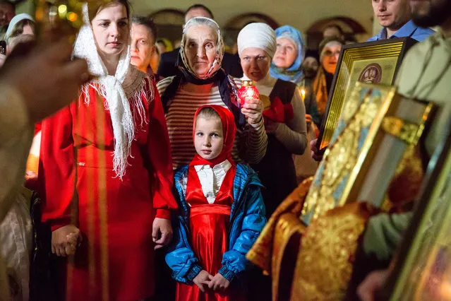 Believers attend an Easter service at the Cathedral of St Michael the Archangel in Grozny, Russia on April 27, 2019. (Photo by Yelena Afonina/TASS)