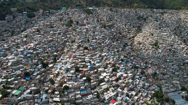 An aerial view of Port-au-Prince, Haiti, March 7, 2024. Haiti's troubled capital was put under a state of emergency for another month on March 7 as authorities struggle to rein in violent gangs demanding the prime minister resign. The decree, published in the official gazette, came as the gangs – who already rule significant parts of Port-au-Prince – extended their control with further attacks on law enforcement. (Photo by Clarens Siffroy/AFP Photo)
