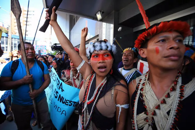 Members of the indigenous Waorani ethnic group, from the Amazon of Ecuador, march to demand that the country's justice system ratifies a ruling that admits a violation of prior consultation in the bidding of an oil project in its territory, in Quito, Ecuador, 16 May 2019. (Photo by José Jácome/EPA/EFE)