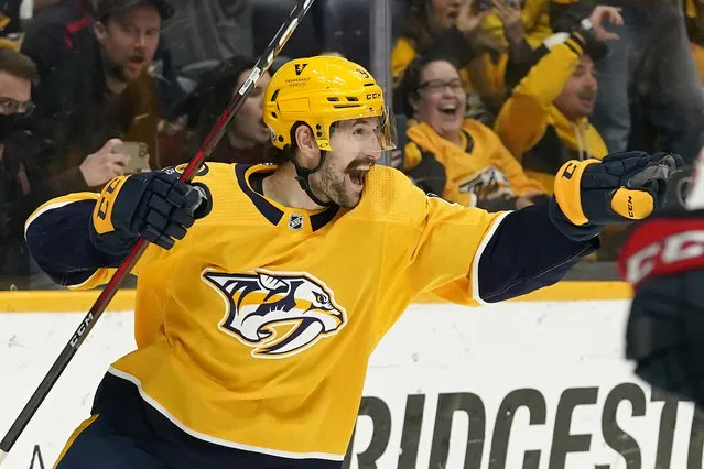 Nashville Predators left wing Filip Forsberg celebrates after scoring his third goal against the Columbus Blue Jackets in the second period of an NHL hockey game Tuesday, November 30, 2021, in Nashville, Tenn. (Photo by Mark Humphrey/AP Photo)
