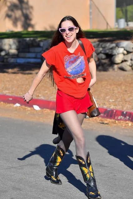 Actress Scout Willis are pictured shopping for vintage clothing at a flea market in California on December 12, 2021. Scout wore a vintage t-shirt, red shorts, and cowboy boots. (Photo by The Image Direct)