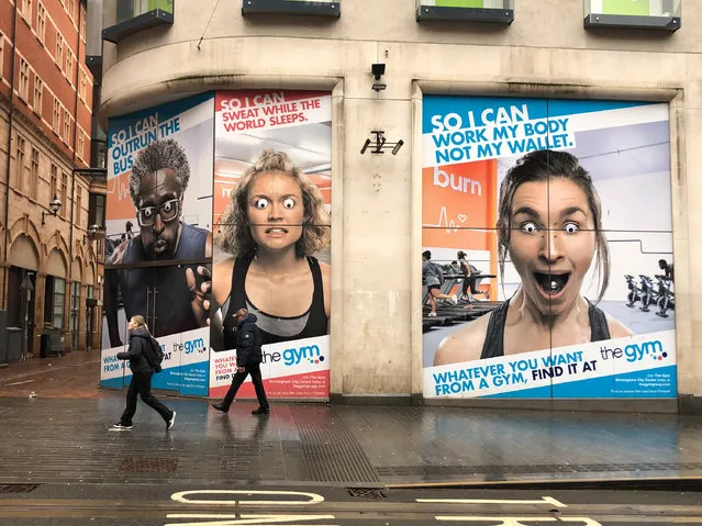 Corporation Street in Birmingham City Centre, United Kingdom on January 11, 2023 where googly eyes have appeared on the faces of those pictured for a gym advert. Members of the public who saw the adverts said “that's hilarious” and “I didn't even spot that, that's genius”. (Photo by Joseph Walshe/South West News Service)