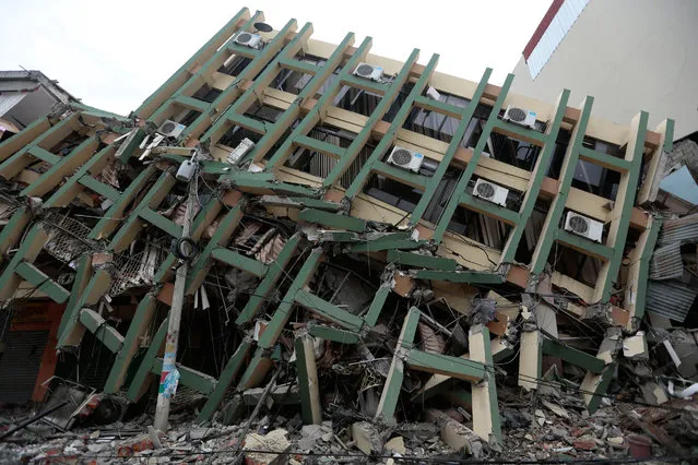 View of a fallen building after a 7.8-magnitude quake in Portoviejo, Ecuador on April 17, 2016. (Photo by Juan Cevallos/AFP Photo)