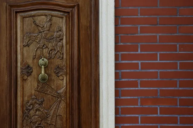 A wooden door carved with Don Quixote motives is seen at the entrance of a home in Alcazar de San Juan, Spain, April 5, 2016. (Photo by Susana Vera/Reuters)