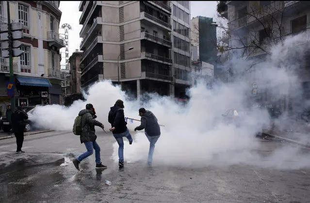 Farmers clash with riot policemen during a protest outside the Greek Agriculture Ministry on March 8, 2017 in Athens, Greece. Farmers protested against the government's tax and pension system reforms. Clashes broke out with riot police using teargas to repel the protesters. (Photo by Milos Bicanski/Getty Images)