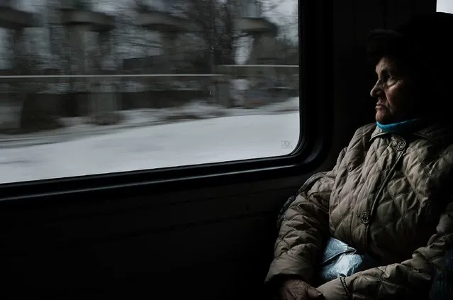 A woman looks out the window while riding on a train on March 5, 2017 in Moscow, Russia. (Photo by Spencer Platt/Getty Images)