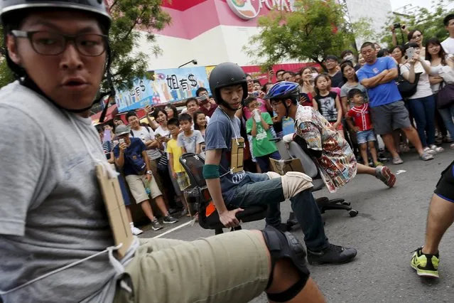 Competitors take part in the office chair race ISU-1 Grand Prix in Tainan, southern Taiwan April 24, 2016. (Photo by Tyrone Siu/Reuters)