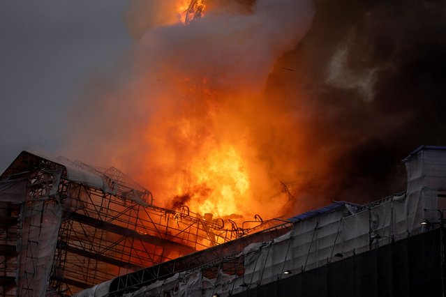 Fire burns at the Old Stock Exchange, Boersen, in Copenhagen, Denmark on April 16, 2024. (Photo by Ida Marie Odgaard/Ritzau Scanpix via Reuters)