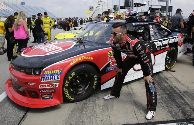 Austin Dillon (33) looks to the track  before the NASCAR Xfinity series auto race at Chicagoland Speedway, Sunday, June 21, 2015, in Joliet, Ill. (AP Photo/Nam Y. Huh) 