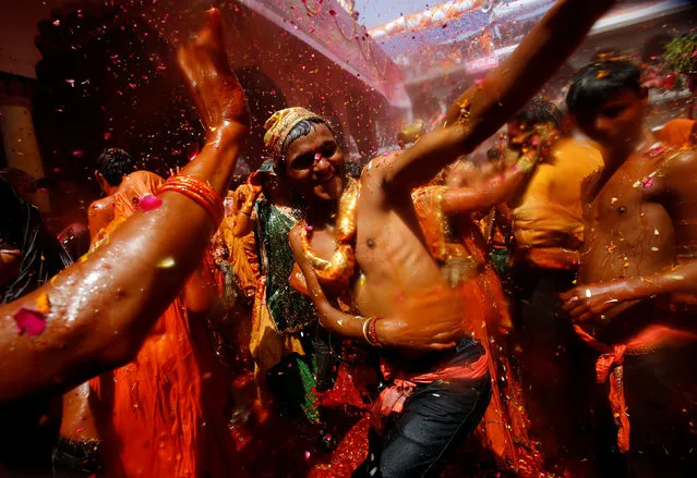 Hindu devotees dance during “Huranga”, a game played between men and women a day after Holi, at Dauji temple near Mathura, March 14, 2017. (Photo by Adnan Abidi/Reuters)