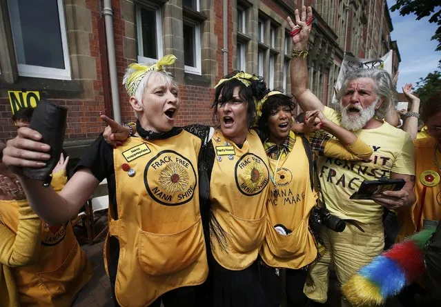 Anti-fracking protesters celebrate a rejected fracking planning application during a demonstration outside County Hall in Preston, Britain June 29, 2015. British officials on Monday rejected another Cuadrilla Resources shale gas project in northwest England on the grounds of visual and noise impact, just four days after refusing a different shale gas planning application. (Photo by Andrew Yates/Reuters)