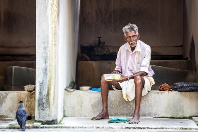 “A worker enjoys a well-earned lunch break from doing the laundry at Dhobi Khana, Fort Kochi, Kerala, India. It was early afternoon and the place wasn’t particularly busy”. (Photo by George Kerridge/The Guardian)