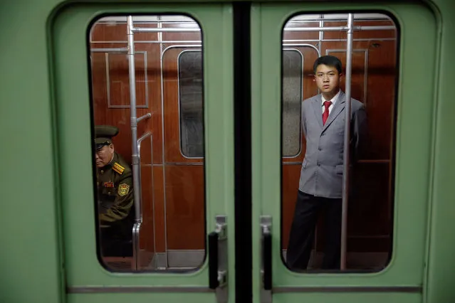 Passengers travel on a subway in central Pyongyang, North Korea May 7, 2016. (Photo by Damir Sagolj/Reuters)